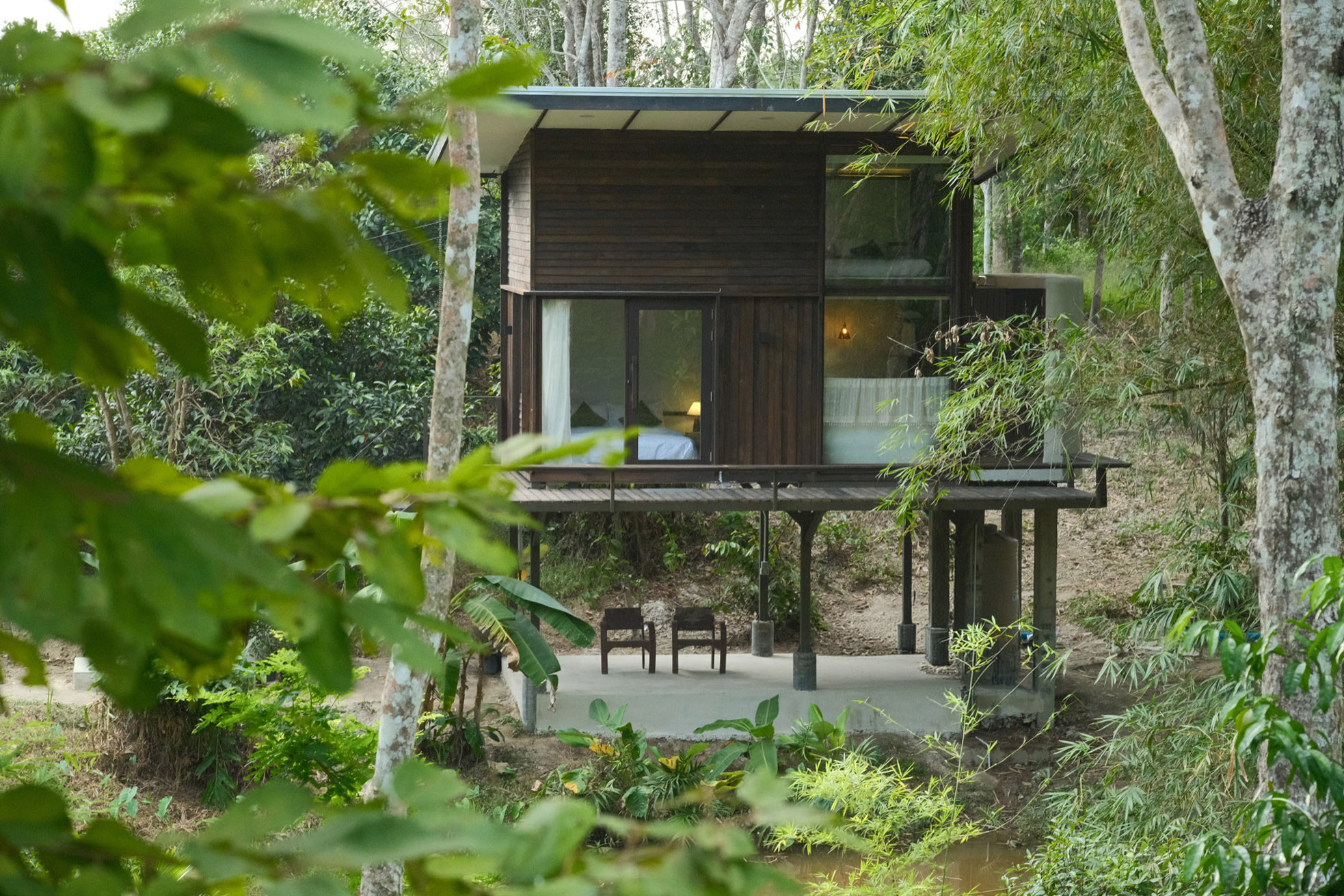 Kalm Cabin nestled in lush tropical forest